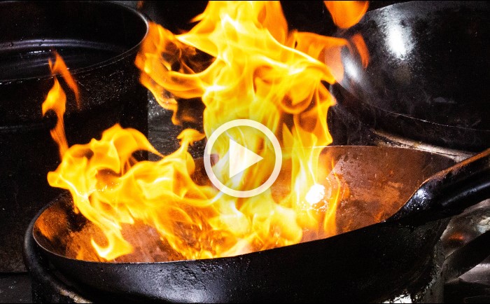 image of fiery wok - PLAY VIDEO button
